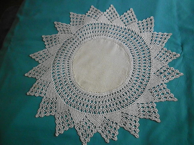 Beige Cloth and Crocheted Doily
